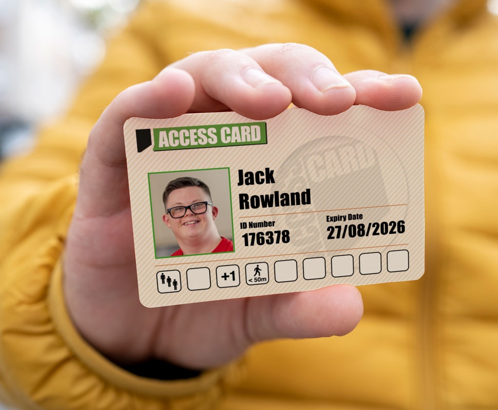 A man holding his Access Card to the camera, showing his photo ID and set of access icons