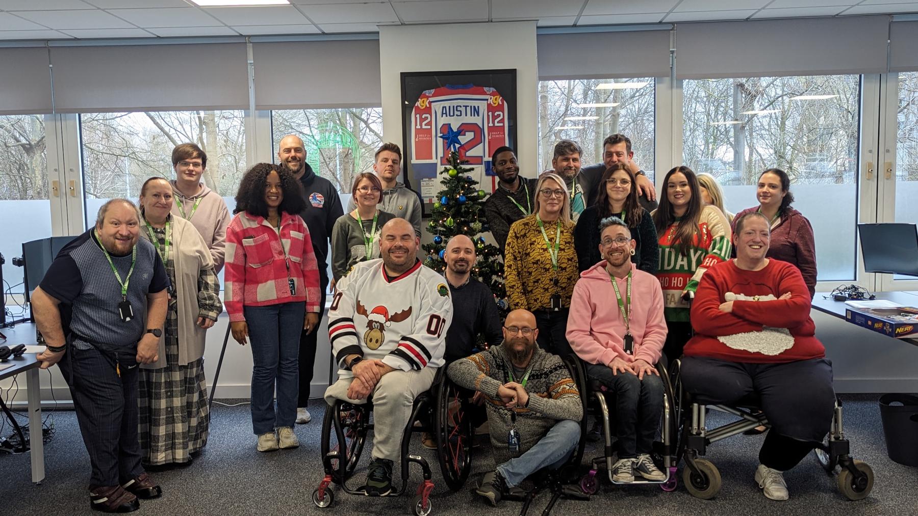 An image of the members of the access card team sitting at a large table of food enjoying their christmas 'fuddle'!